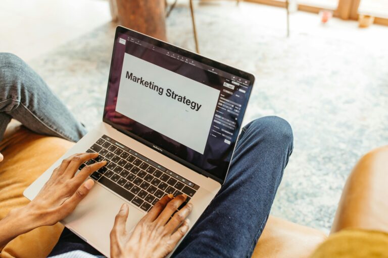 A laptop with "Marketing Strategy" in it